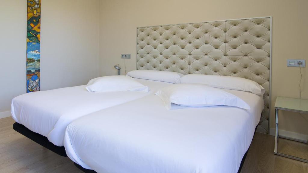 Postel nebo postele na pokoji v ubytování RuralSuite Hotel Apartamentos