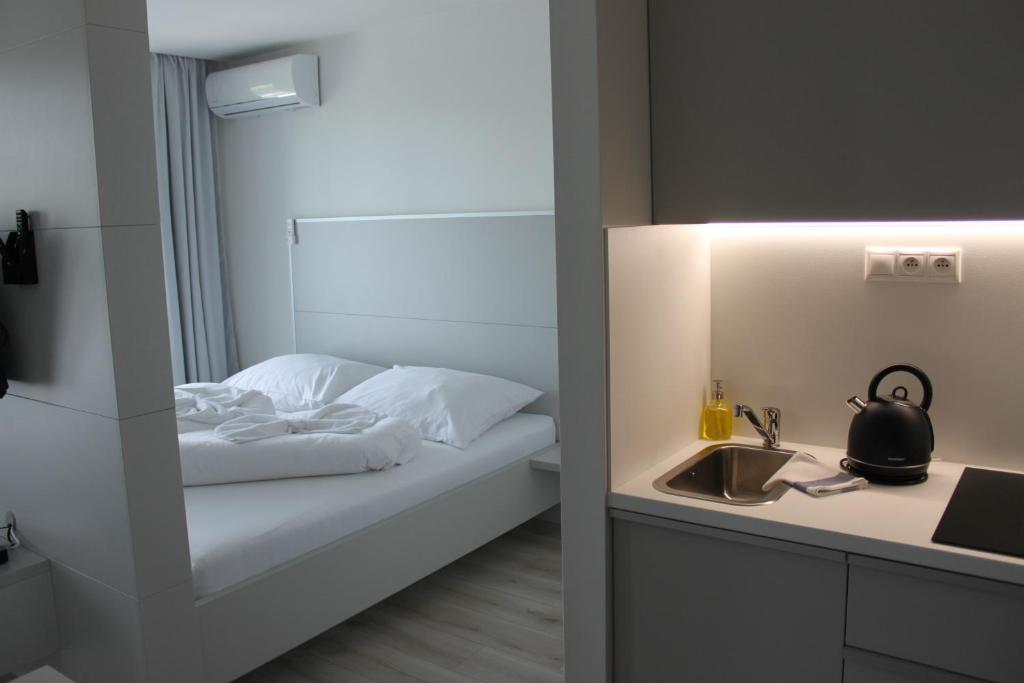Postel nebo postele na pokoji v ubytování Apartmany Arcadia