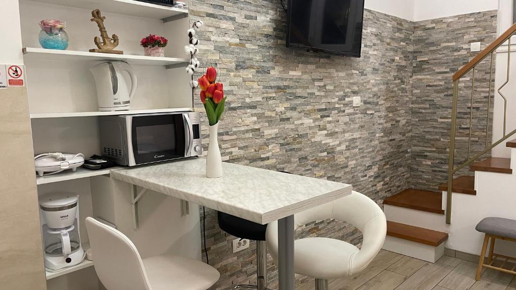 Televízia a/alebo spoločenská miestnosť v ubytovaní ST-Gallery Apartment