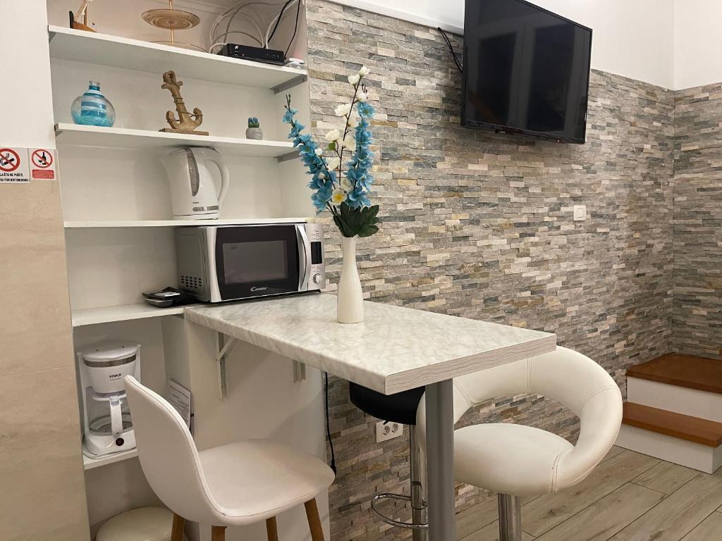 Televízia a/alebo spoločenská miestnosť v ubytovaní ST-Gallery Apartment