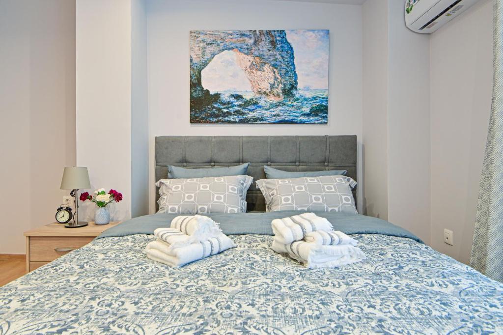 Postel nebo postele na pokoji v ubytování Charming apartment with a sea view terrace (F1)