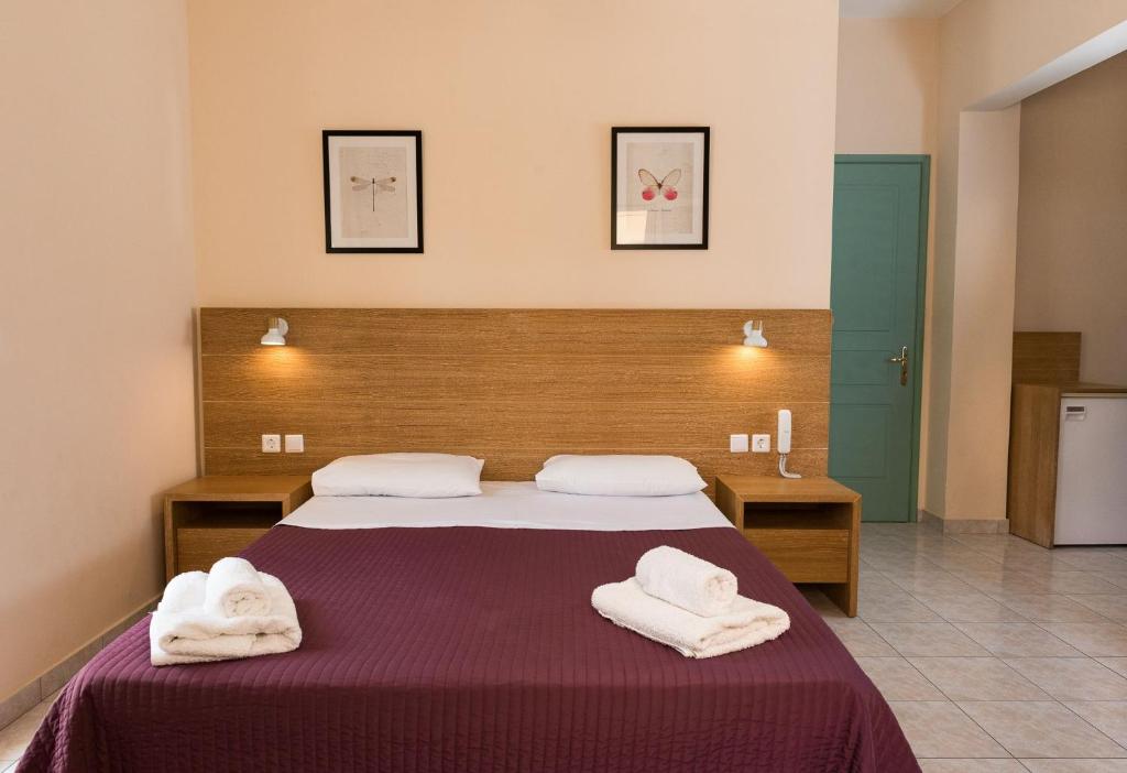 Postel nebo postele na pokoji v ubytování Theano Hotel