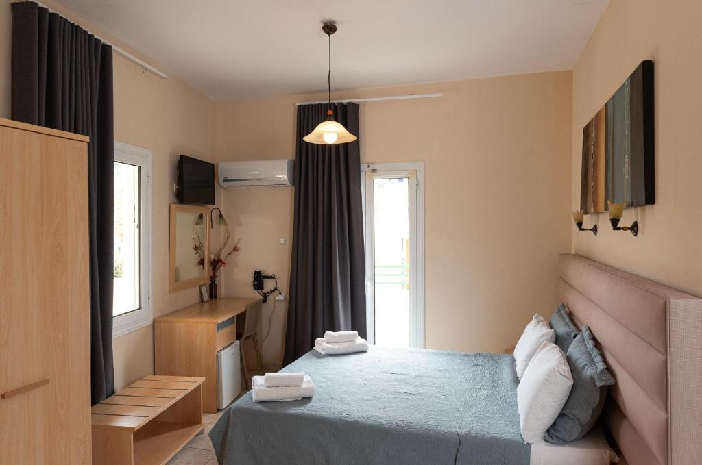 Postel nebo postele na pokoji v ubytování Theano Hotel