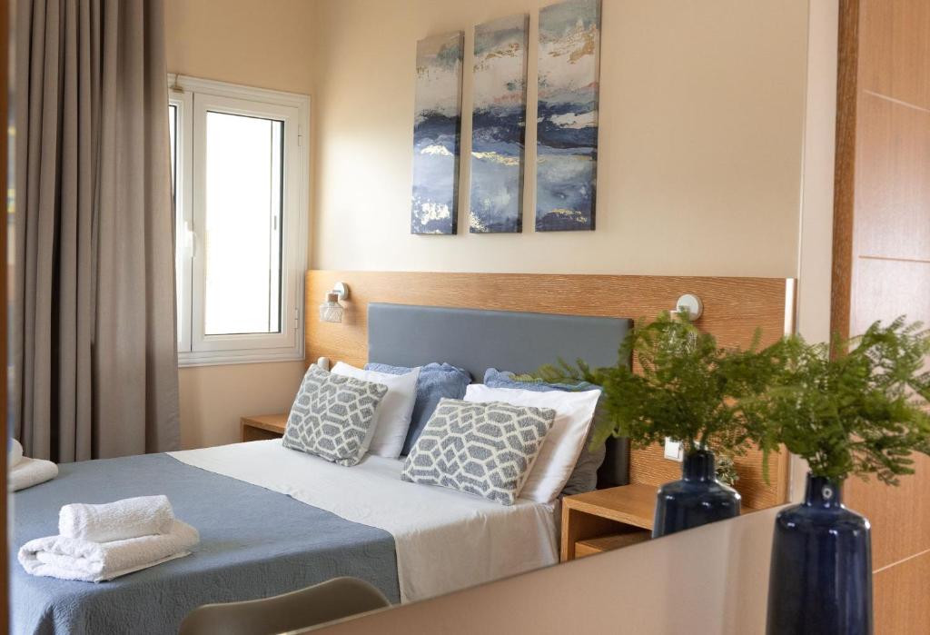 Postel nebo postele na pokoji v ubytování Theano Hotel