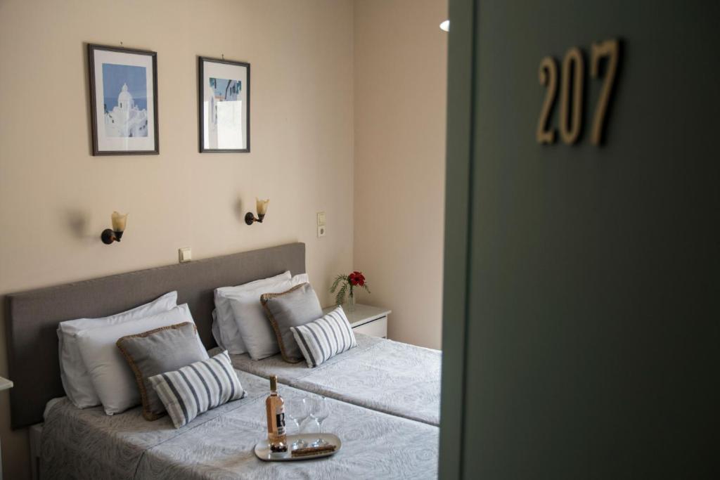 Postel nebo postele na pokoji v ubytování Theano Hotel