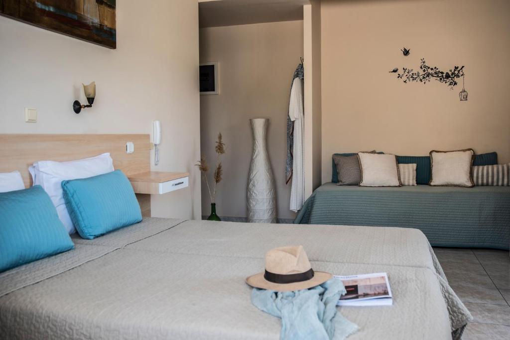 Postel nebo postele na pokoji v ubytování Theano Hotel