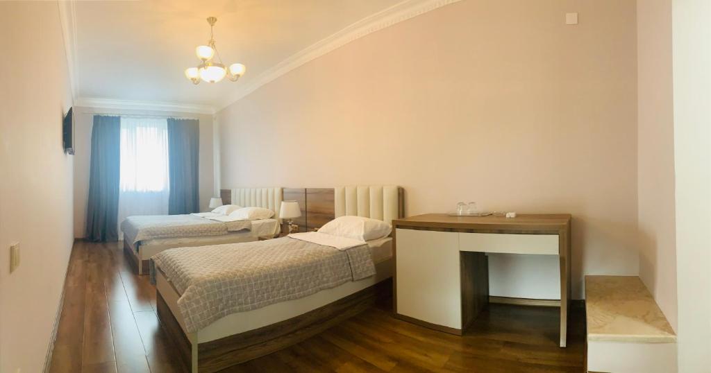 Postel nebo postele na pokoji v ubytování David's Guest House