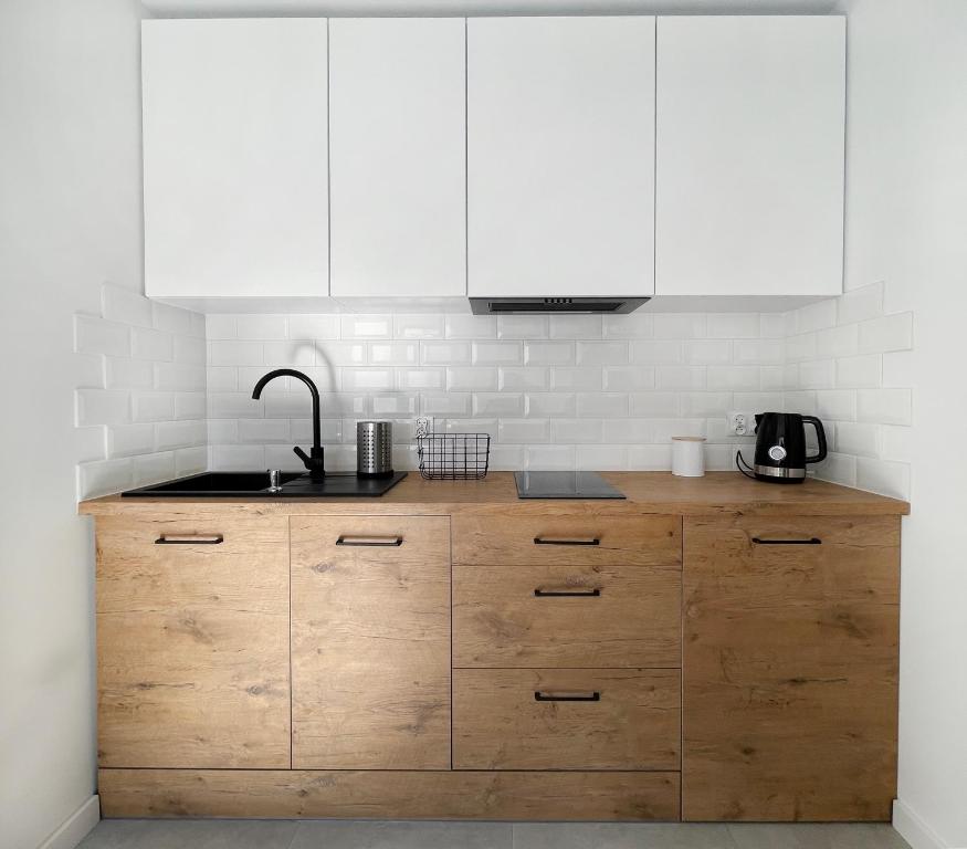 Kuchyňa alebo kuchynka v ubytovaní Przytulny apartament 500m od morza.