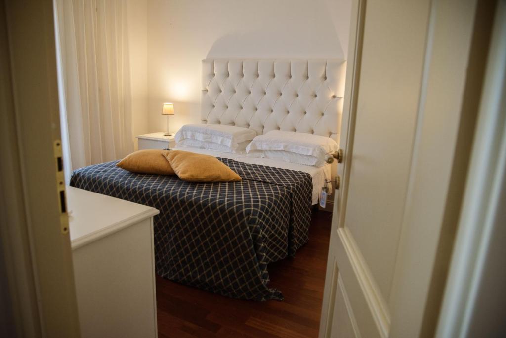 Postel nebo postele na pokoji v ubytování B&B L'ORIZZONTE