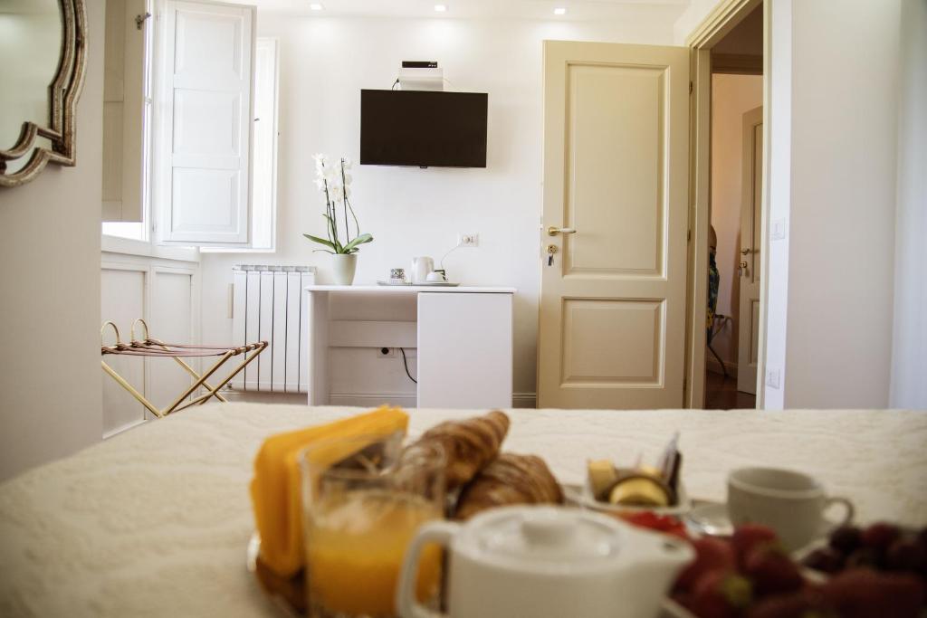 TV a/nebo společenská místnost v ubytování B&B L'ORIZZONTE