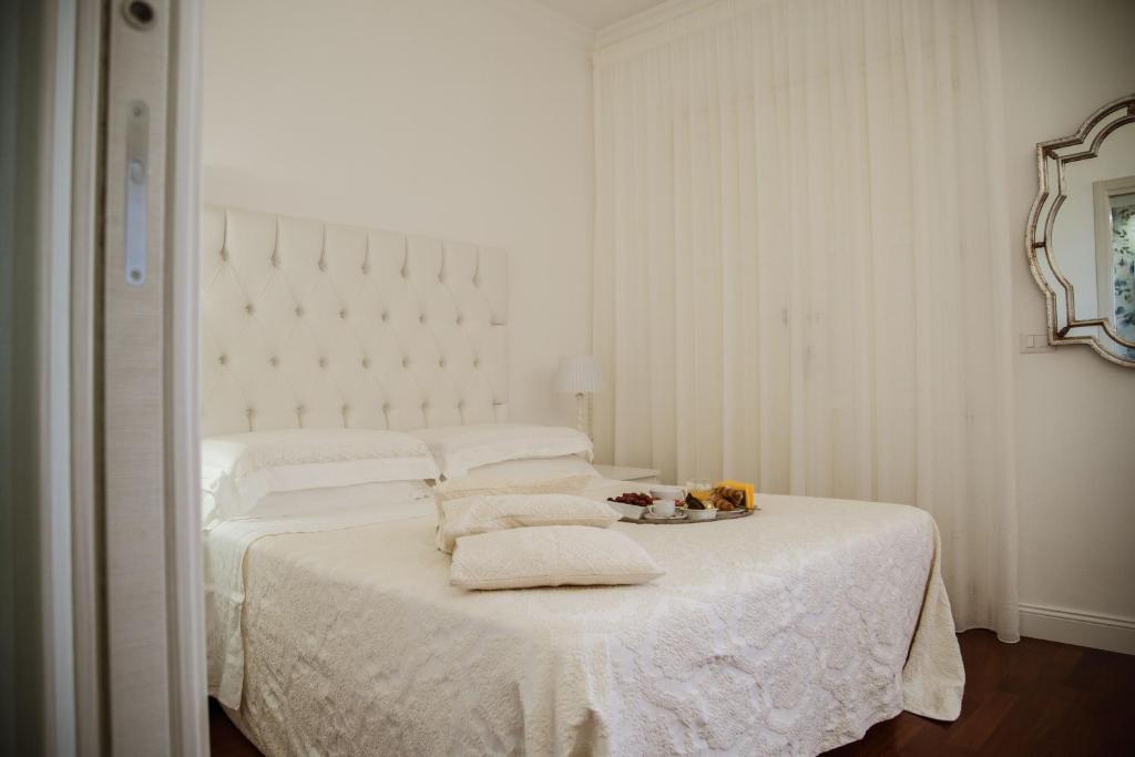 Postel nebo postele na pokoji v ubytování B&B L'ORIZZONTE