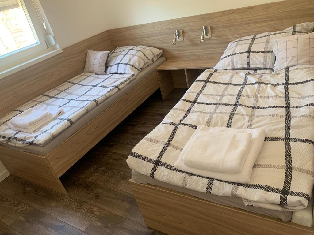 Postel nebo postele na pokoji v ubytování Pogánykő Vendégház 1