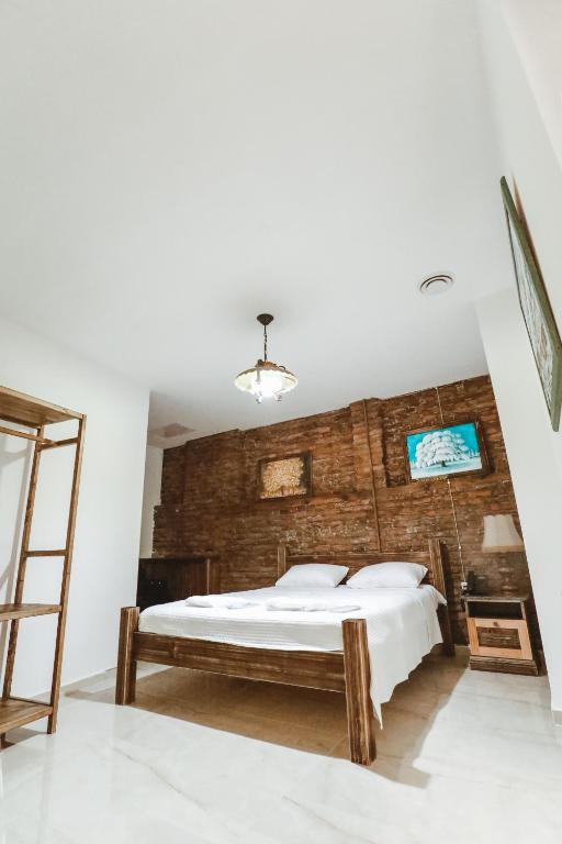 Postel nebo postele na pokoji v ubytování Boutique Hotel Verdzi