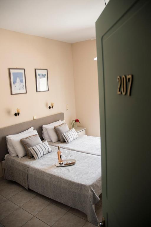 Postel nebo postele na pokoji v ubytování Theano Hotel