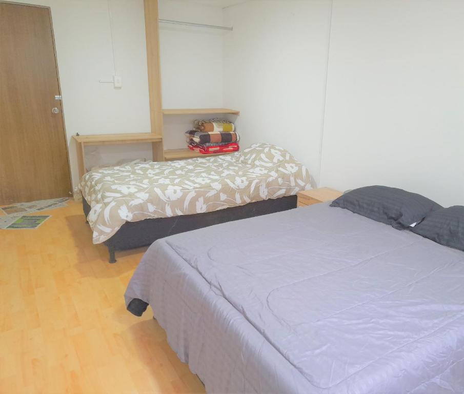 Postel nebo postele na pokoji v ubytování Casa Jaguar Manizales sector Cable