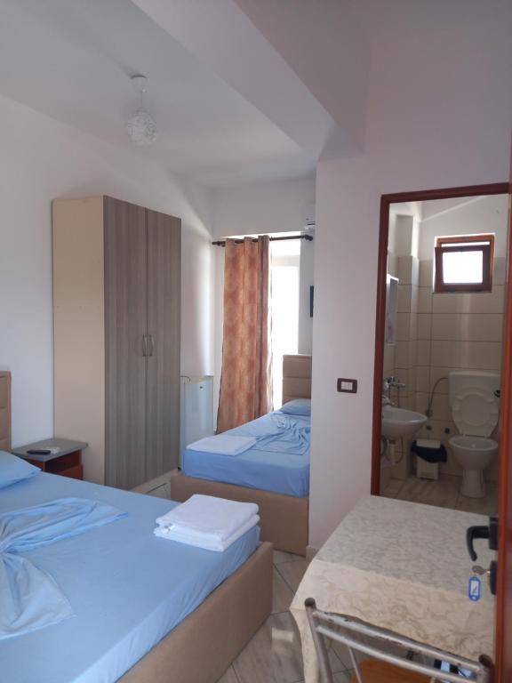 Postel nebo postele na pokoji v ubytování Bar Restorant Hotel Altini