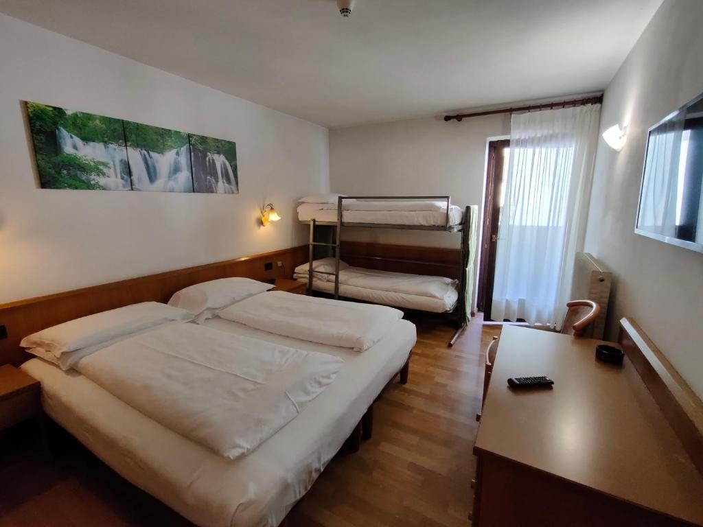 Postel nebo postele na pokoji v ubytování Hotel Denny