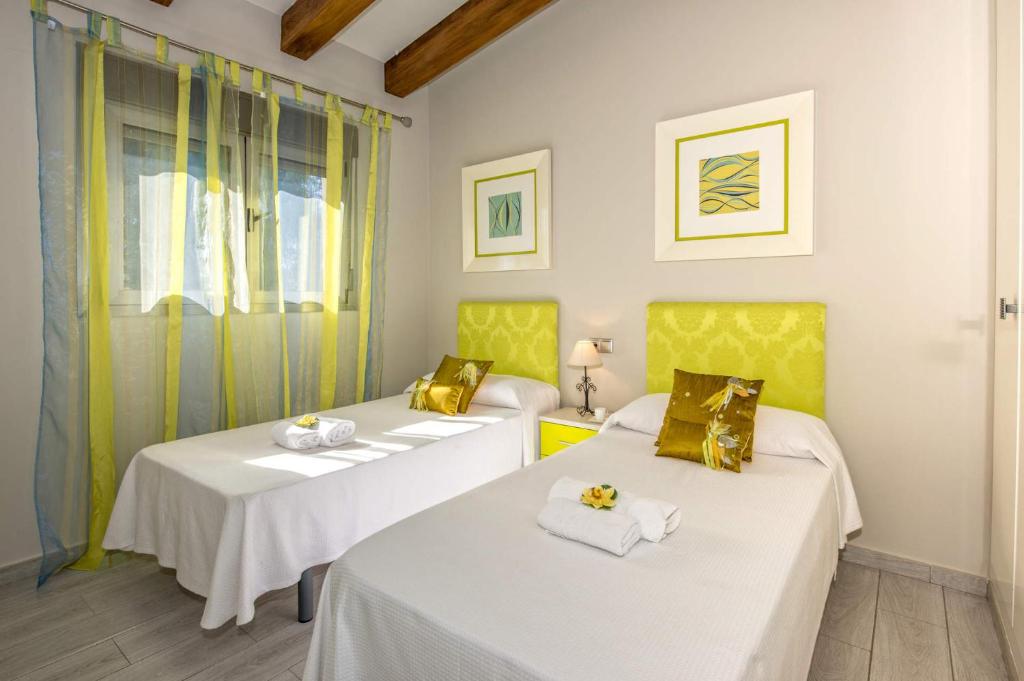 Postel nebo postele na pokoji v ubytování Villa Tosca by Villa Plus