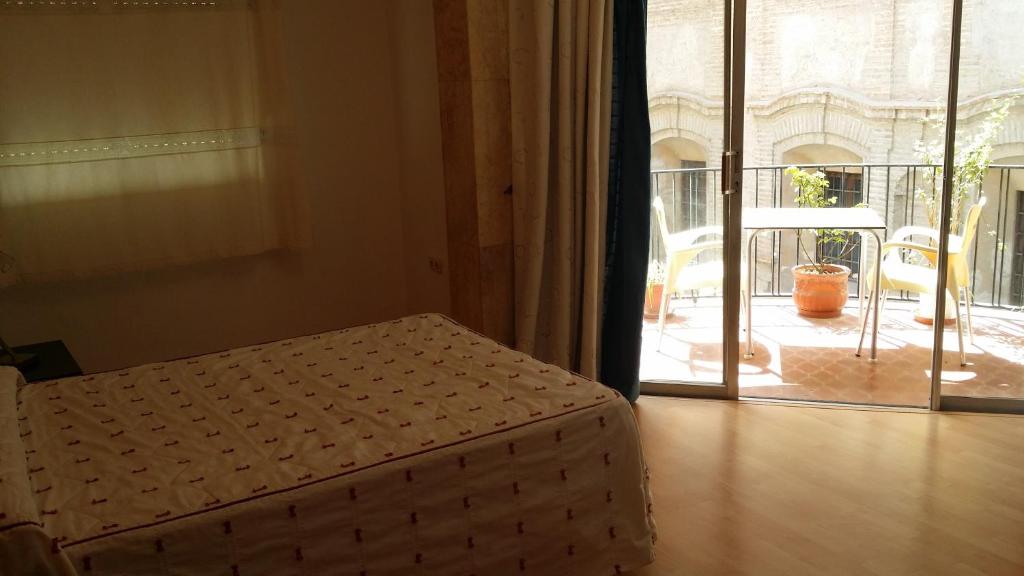 Posteľ alebo postele v izbe v ubytovaní Hotel Mesón El Número Uno