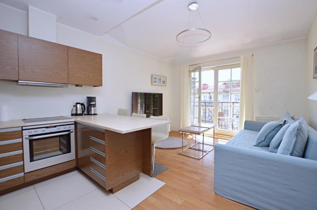 Kuchyňa alebo kuchynka v ubytovaní Victus Apartamenty, Apartament Faro