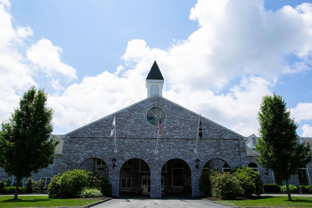 a large stone church with a steeple at Colonial Hotel in Gardner