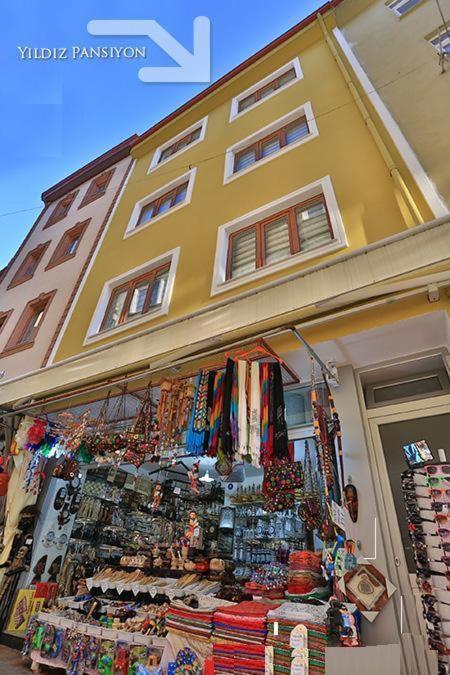 a store in front of a building with a lot of merchandise at Yıldız Pansiyon in Amasra