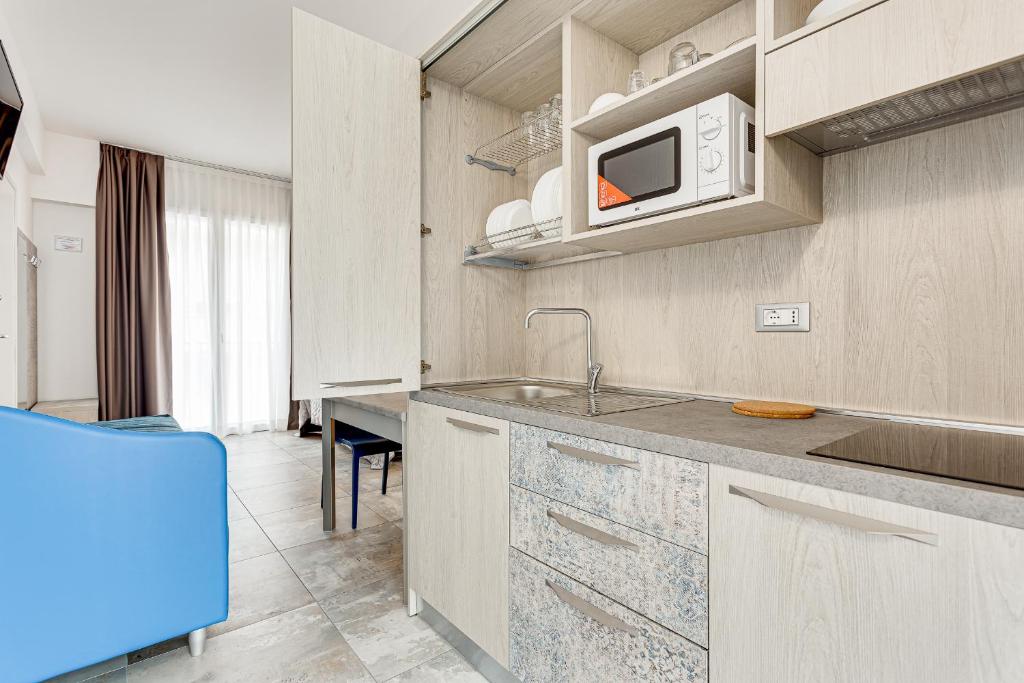 Kuchyň nebo kuchyňský kout v ubytování Hotel Belturismo