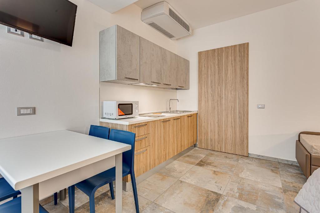 Kuchyň nebo kuchyňský kout v ubytování Hotel Belturismo