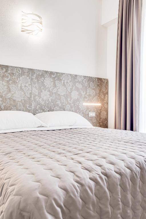 Postel nebo postele na pokoji v ubytování Hotel Belturismo