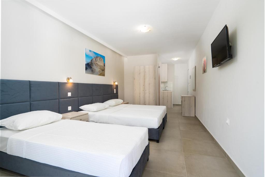 Postel nebo postele na pokoji v ubytování Atrium Hotel