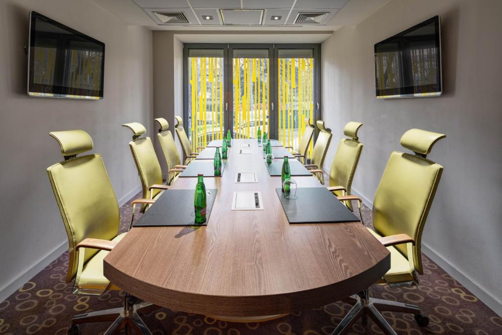 a conference room with a long table and chairs at Clarion Congress Hotel Bratislava in Bratislava