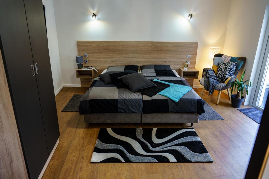 Ένα ή περισσότερα κρεβάτια σε δωμάτιο στο Mosel-Apartments-Koblenz