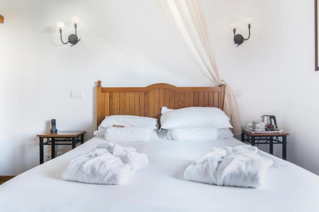 Voodi või voodid majutusasutuse Hotel Dom Vasco toas