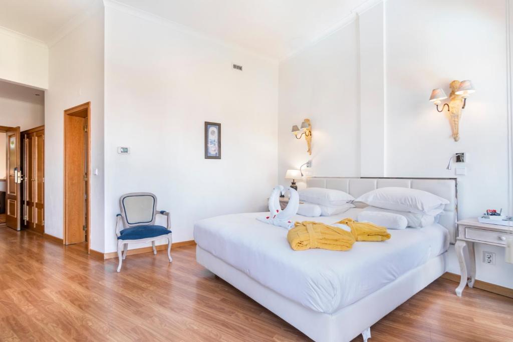 Voodi või voodid majutusasutuse Hotel Dom Vasco toas