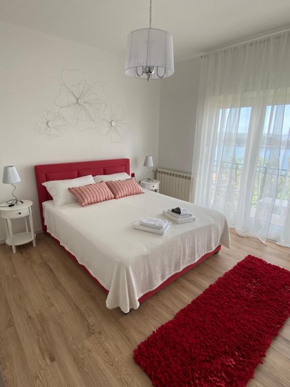 Postel nebo postele na pokoji v ubytování Apartman Betty