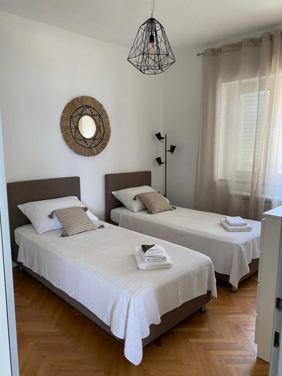 Postel nebo postele na pokoji v ubytování Apartman Betty
