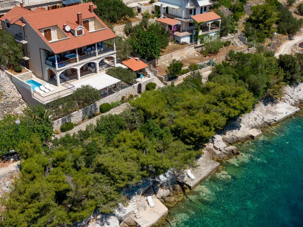 an aerial view of a house next to the water at Villa Amfora in Prizba