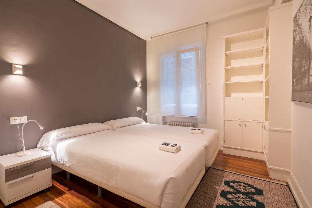 Postel nebo postele na pokoji v ubytování Ibarrola Apartment by People Rentals