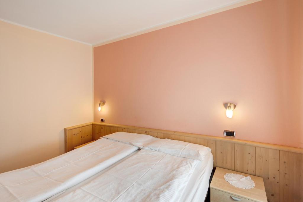 Łóżko lub łóżka w pokoju w obiekcie Appartamento Valleverde