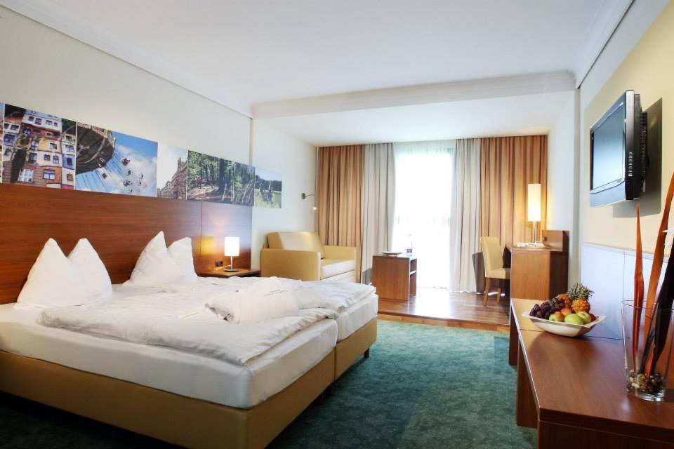 Postel nebo postele na pokoji v ubytování Seminarhotel Lengbachhof GmbH