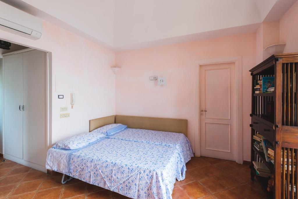 A bed or beds in a room at Casale Ianus - Country house with Panoramic View