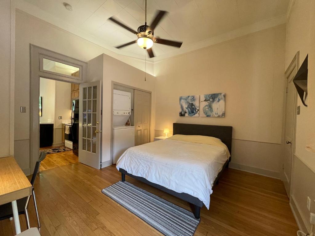 a bedroom with a bed and a ceiling fan at 1322-#6 Downtown high ceiling big size 1B unit in San Antonio