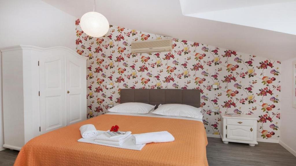 Postel nebo postele na pokoji v ubytování Apartments Angela