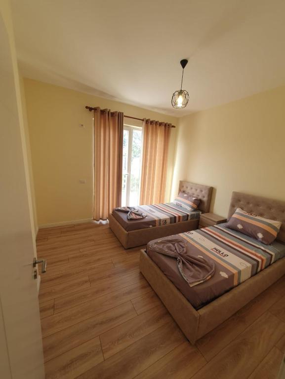 Postel nebo postele na pokoji v ubytování Milenium Apartments