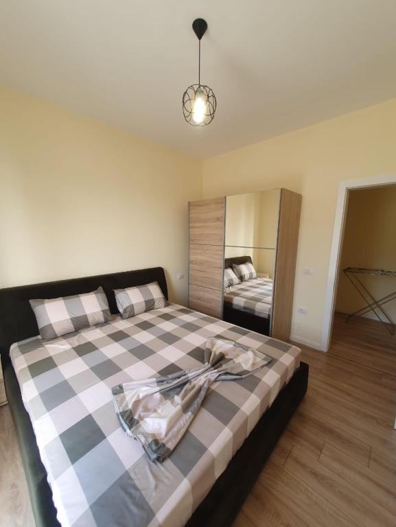 Postel nebo postele na pokoji v ubytování Milenium Apartments