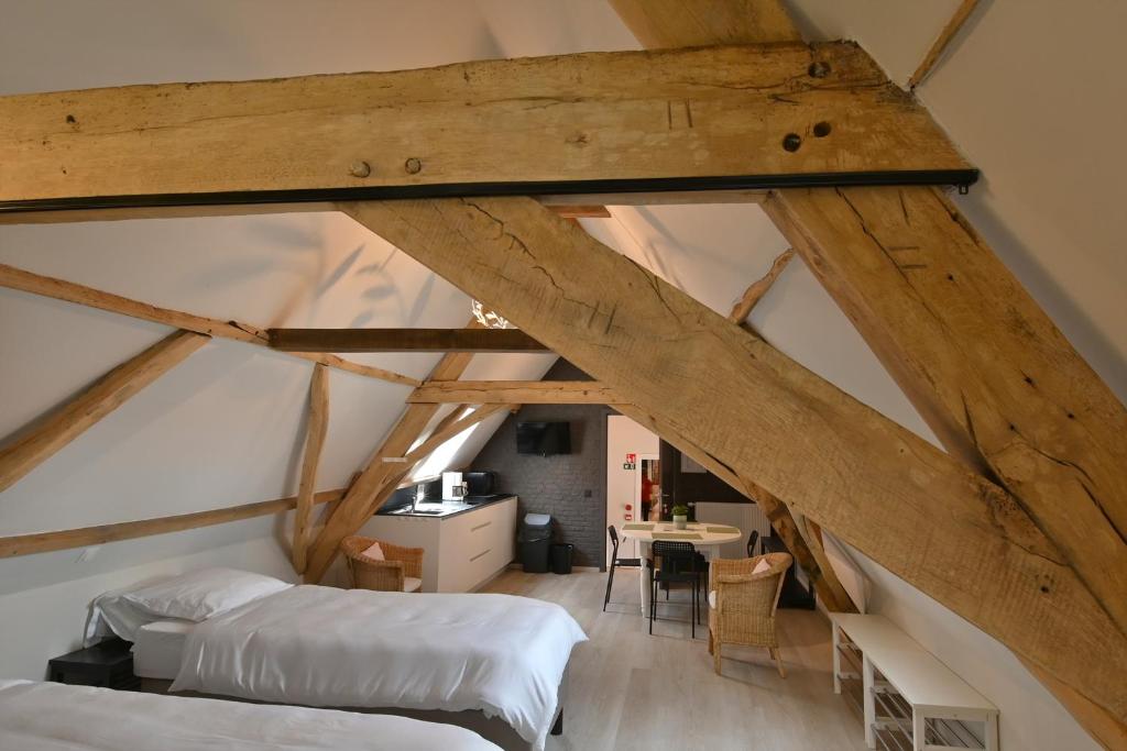 Postel nebo postele na pokoji v ubytování Hoeve Ten Rooden Duifhuize
