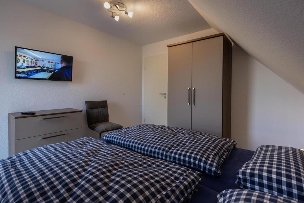 Postel nebo postele na pokoji v ubytování binnen un' buten