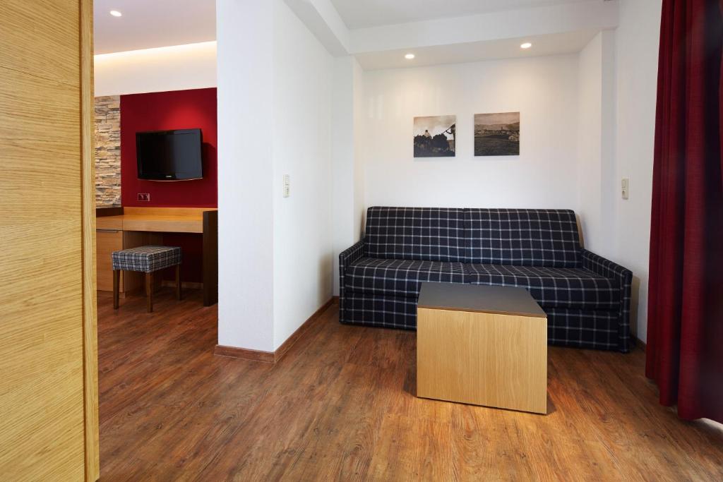 TV a/nebo společenská místnost v ubytování Hotel Cores