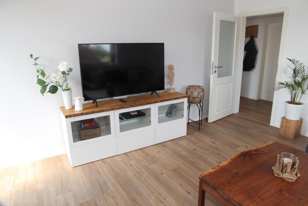 TV a/nebo společenská místnost v ubytování Deichblick 2