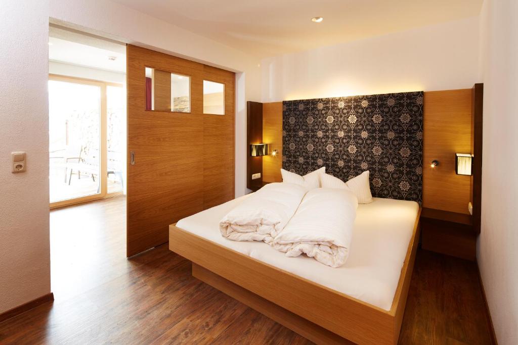 Postel nebo postele na pokoji v ubytování Hotel Cores